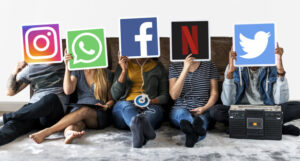people holding social media icons